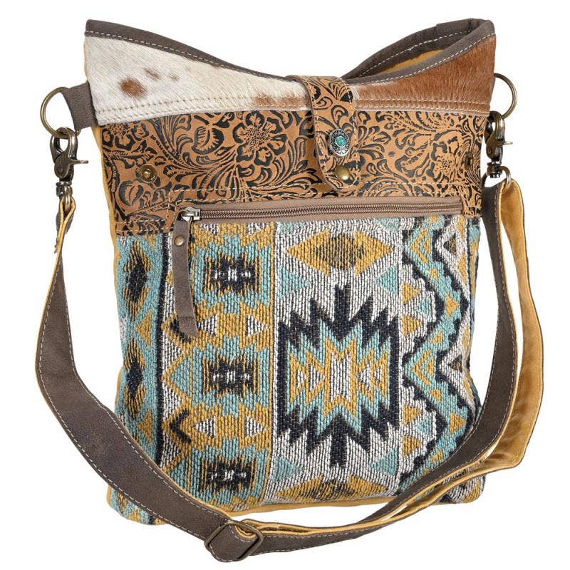 CANVAS, LEATHER & RECYCLED RUG W/ NATURAL HIDE BAG