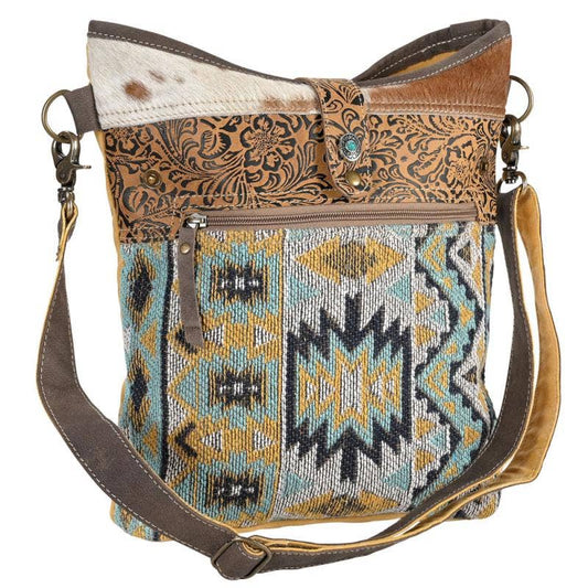 CANVAS, LEATHER & RECYCLED RUG W/ NATURAL HIDE BAG