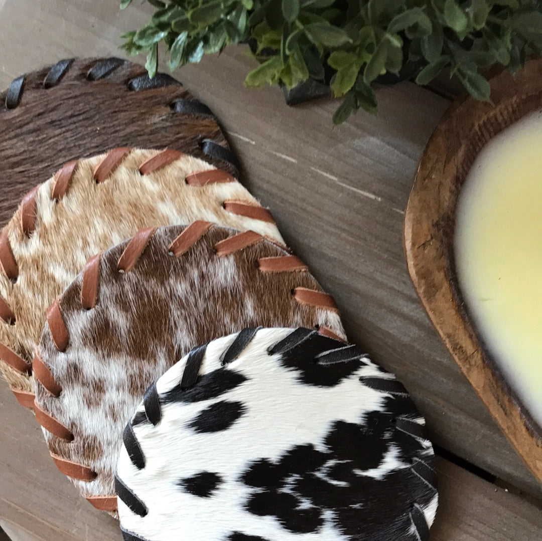 set of four cowhide coasters