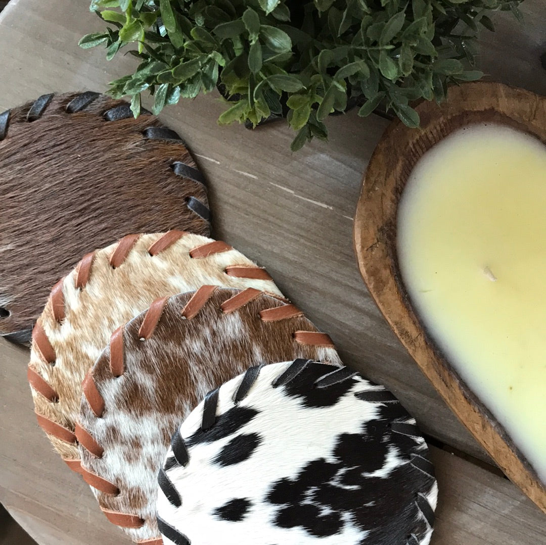 set of four cow hide costers